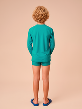 Load image into Gallery viewer, Model Back: Kids' Long Sleeve Rash Guard — Sea Green, UPF50+
